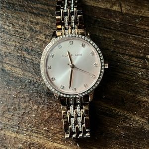 I paid 250$ for it a year ago. From Micheal Kors.